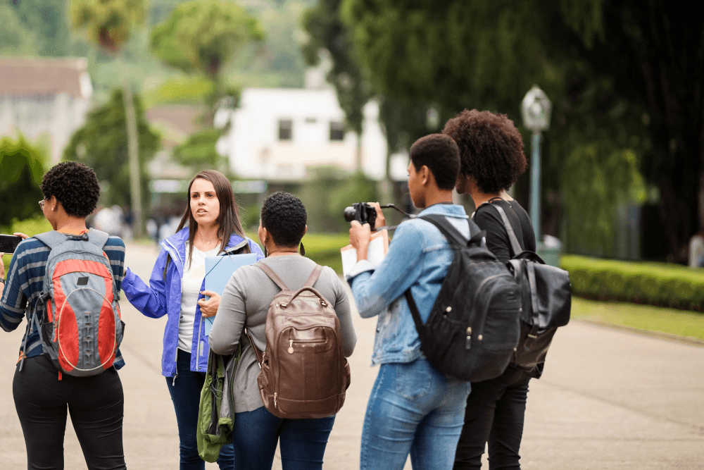 People with cameras on walking tour